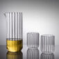Minimalist studio setting with Fferrone Dearborn Large Carafe and matching glasses in fluted borosilicate glass featuring a clear ribbed texture | Kneen & Co