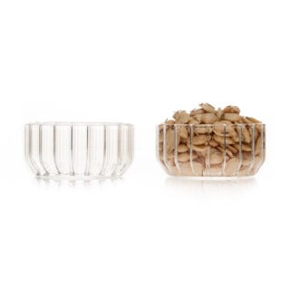 Clean white studio background with a pair of Fferrone Dearborn Medium Bowls in fluted borosilicate glass shown empty and filled with roasted almonds | Kneen & Co