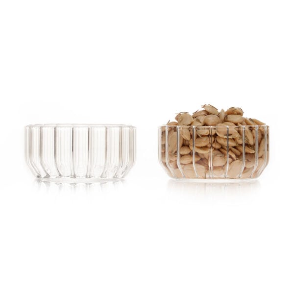 Clean white studio background with a pair of Fferrone Dearborn Medium Bowls in fluted borosilicate glass shown empty and filled with roasted almonds | Kneen & Co