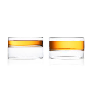 Minimalist white studio background with a pair of Fferrone Revolution Large Bowls in borosilicate glass | Kneen & Co