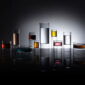 Dark dramatic studio setting with Fferrone Revolution Barware in borosilicate glass with back-lit colored liquid variants | Kneen & Co