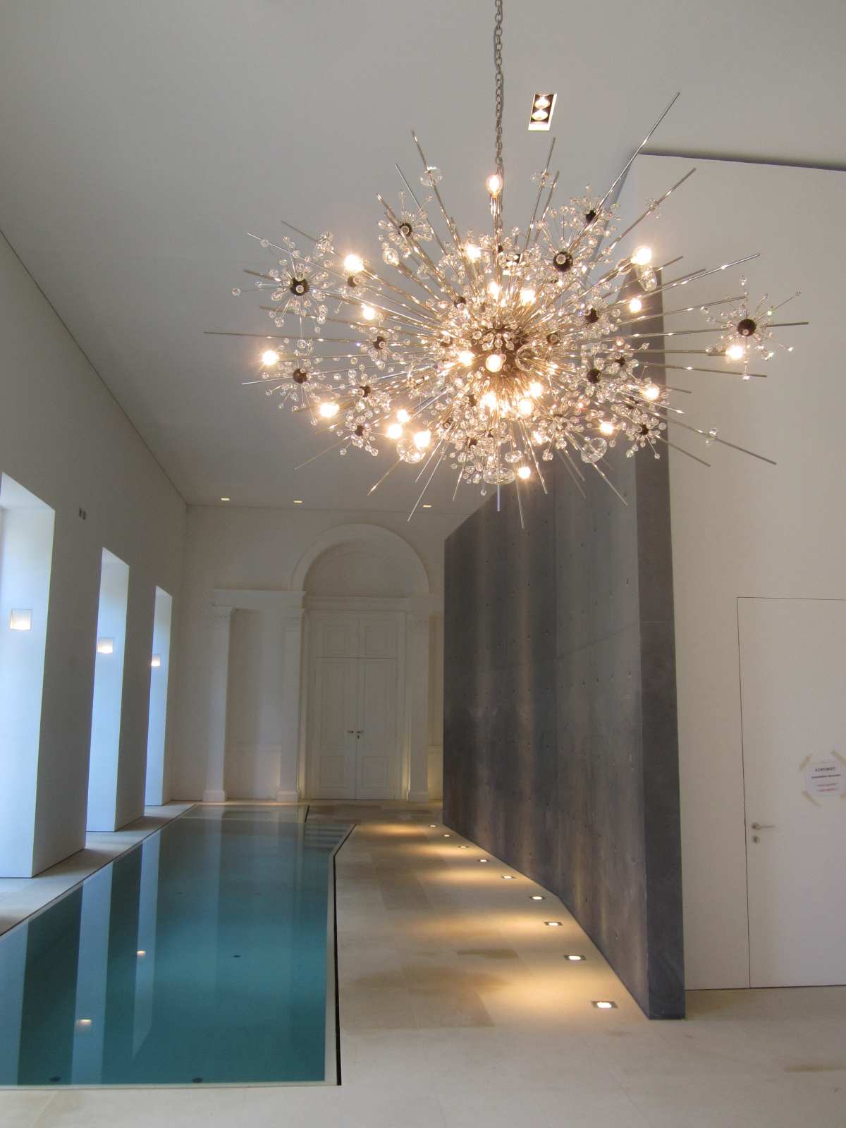 Lobmeyr Metropolitan Chandelier interior near pool | Kneen & Co