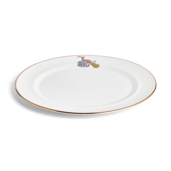 Close-up studio shot with Wedgwood Kit Kemp Mythical Creatures Charger Plate in fine bone china featuring whimsical animal illustrations and gold rim detailing | Kneen & Co