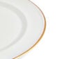 Close-up studio shot with Wedgwood Kit Kemp Mythical Creatures Charger Plate in fine bone china featuring whimsical animal illustrations and gold rim detailing | Kneen & Co