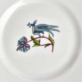 701587190299-Wedgwood-Mythical-Creatures-Plate-15pt5cm-6in-detail-1200×1200-100KB Close-up studio shot with Wedgwood Kit Kemp Mythical Creatures Bread Plate in fine bone china featuring whimsical animal illustrations and gold rim detailing | Kneen & Co