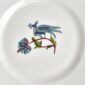 Close-up studio shot with Wedgwood Kit Kemp Mythical Creatures Bread Plate in fine bone china featuring whimsical animal illustrations and gold rim detailing | Kneen & Co