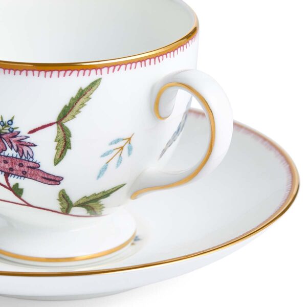 701587253048-Wedgwood-Mythical-Creatures-Teacup+Saucer-Leigh-BXD-detail-1200x1200-100KB Close-up studio shot with Wedgwood Kit Kemp Mythical Creatures Tea Cup and Saucer in fine bone china featuring whimsical animal illustrations and gold rim detailing | Kneen & Co