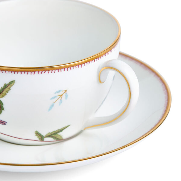701587253055-Wedgwood-Mythical-Creatures-Bute-Cup+Saucer-BXD-detail-1200x1200-100KB Close-up studio shot with Wedgwood Kit Kemp Mythical Creatures Breakfast Cup and Saucer in fine bone china featuring whimsical animal illustrations and gold rim detailing | Kneen & Co