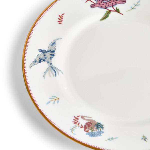 Close-up studio shot with Wedgwood Kit Kemp Mythical Creatures Salad Plate in fine bone china featuring whimsical animal illustrations and gold rim detailing | Kneen & Co