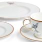 Close-up studio shot with Wedgwood Kit Kemp Mythical Creatures 5-piece Dinnerware Set in fine bone china featuring whimsical animal illustrations and gold rim detailing | Kneen & Co