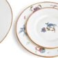 Close-up studio shot with Wedgwood Kit Kemp Mythical Creatures 5-piece Dinnerware Set in fine bone china featuring whimsical animal illustrations and gold rim detailing | Kneen & Co