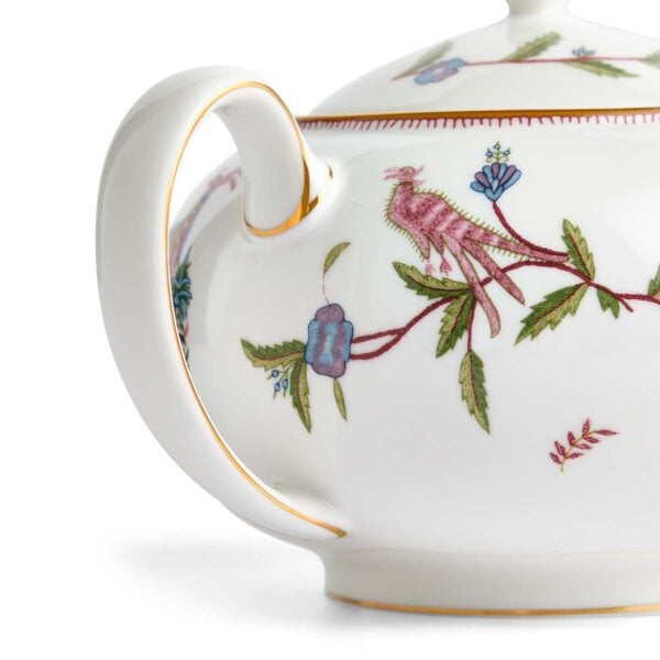 701587253123-Wedgwood-Mythical-Creatures-Large-Sized-Teapot-BXD-detail-1200x1200-100KB Close-up studio shot with Wedgwood Kit Kemp Mythical Creatures Teapot in fine bone china featuring whimsical animal illustrations and gold rim detailing | Kneen & Co