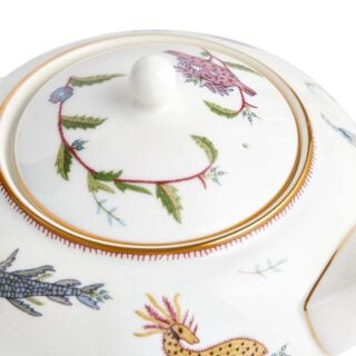 Close-up studio shot with Wedgwood Kit Kemp Mythical Creatures Teapot in fine bone china featuring whimsical animal illustrations and gold rim detailing | Kneen & Co