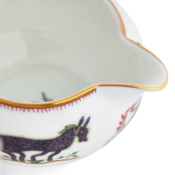 701587253147-Wedgwood-Mythical-Creatures-Large-Sized-Cream-BXD-detail-1200x1200-100KB Close-up studio shot with Wedgwood Kit Kemp Mythical Creatures Creamer in fine bone china featuring whimsical animal illustrations and gold rim detailing | Kneen & Co