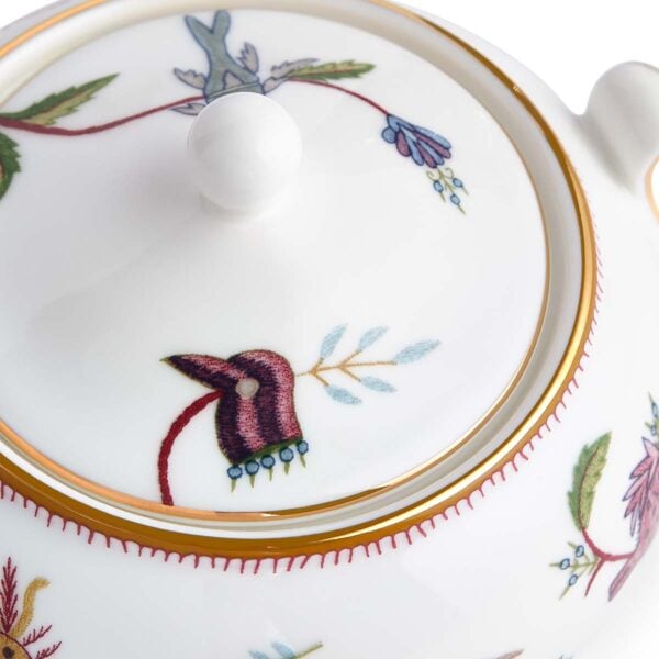 701587253161-Wedgwood-Mythical-Creatures-Cov-Sugar-BXD-detail2-1200x1200-100KB Close-up studio shot with Wedgwood Kit Kemp Mythical Creatures Sugar Pot with Cover in fine bone china featuring whimsical animal illustrations and gold rim detailing | Kneen & Co