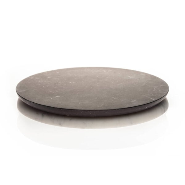 FERRONE-Doppio01-HR-1-1200x1200-100KB Minimalist studio setting with Fferrone Round Serving Tray Marble in honed Nero Marquina marble featuring a reversible dual-tone base | Kneen & Co
