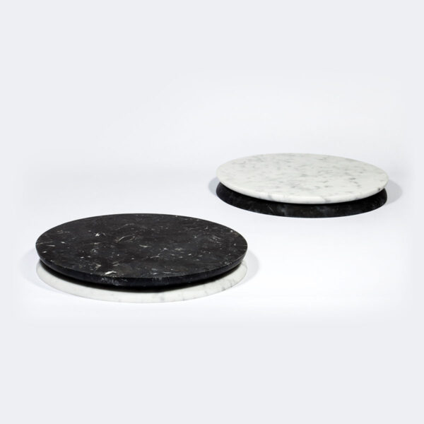 FERRONE-Doppio01-HR-4-1200x1200-100KB Minimalist studio display with Fferrone Doppio Round Serving Tray Marble in honed Nero Marquina and Carrara marble showing the reversible black and white variants | Kneen & Co