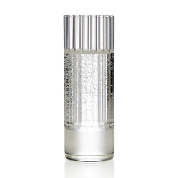 Minimalist studio setting with sparkling water in a Fferrone Flight Collins Glass made of borosilicate glass showcasing the collection’s signature interior fluting | Kneen & Co