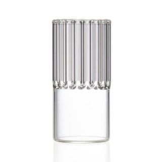 Minimalist studio setting with a dark beverage in a Fferrone Flight Espresso / Liqueur Glass made of borosilicate glass highlighting the small-scale fluted design | Kneen & Co