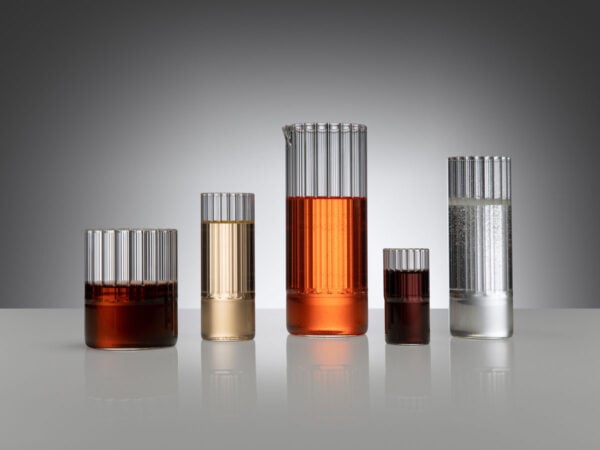 Dramatic studio setting with backlit beverages in Fferrone Flight Glassware made of borosilicate glass featuring the collection's signature interior fluting | Kneen & Co