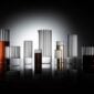 High-contrast moody studio setting with reflective surfaces and Fferrone Flight Glassware in borosilicate glass showcasing the collection’s full range of fluted glassware | Kneen & Co