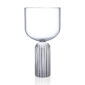 Minimalist studio display of a Fferrone May Large Glass in fluted borosilicate glass featuring a wide smooth bowl and a ribbed cylindrical pedestal base | Kneen & Co