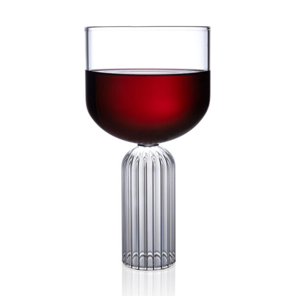 FERRONE-LargeGlass-MALG02-HR-02-Styled-1200x1200-100KB Minimalist studio display of a Fferrone May Large Glass in fluted borosilicate glass filled with red wine featuring a wide smooth bowl and a ribbed cylindrical pedestal bas | Kneen & Co