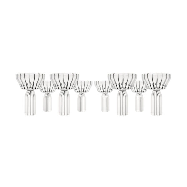 Minimalist studio arrangement of Fferrone Margot Champagne Coupes in fluted borosilicate glass displayed in staggered front and back rows | Kneen & Co