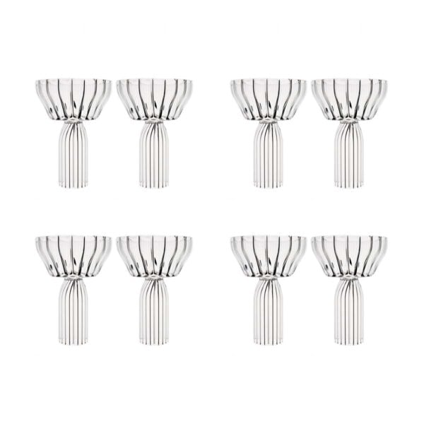 Minimalist studio arrangement of four pairs of Fferrone Margot Champagne Coupes in fluted borosilicate glass featuring a stacked vertical composition | Kneen & Co