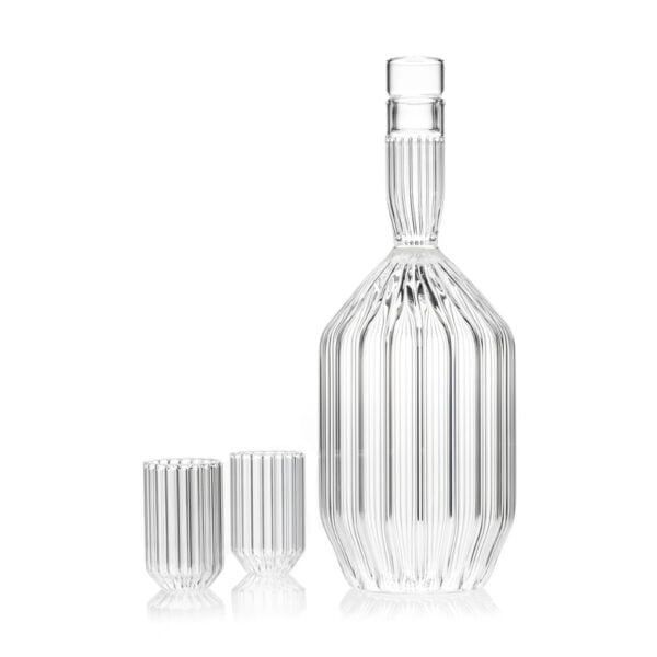Minimalist studio setting with a Fferrone Margot Decanter and Glasses in borosilicate glass showcasing the collection's intricate fluted texture and architectural silhouette | Kneen & Co