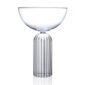 Minimalist studio display of a Fferrone May Coupe in fluted borosilicate glass featuring a smooth clear bowl and a ribbed cylindrical pedestal base | Kneen & Co