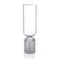 Minimalist studio display of a Fferrone May Flute in fluted borosilicate glass featuring a tall smooth bowl and a ribbed cylindrical pedestal base | Kneen & Co