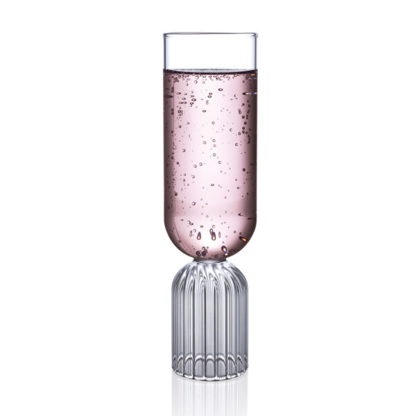 FERRONE-MayFlute-MAFL02-HR-02-Styled-1200x1200-100KB Minimalist studio display of a Fferrone May Flute in fluted borosilicate glass filled with sparkling rosé and featuring a tall smooth bowl on a ribbed cylindrical base | Kneen & Co