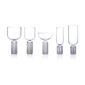 Minimalist studio arrangement of Fferrone May Glassware in fluted borosilicate glass featuring an assortment of wine, coupe, and flute glasses with smooth bowls and ribbed bases | Kneen & Co