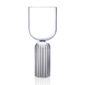 Minimalist studio display of a Fferrone May Medium Glass in fluted borosilicate glass featuring a smooth U-shaped bowl and a ribbed cylindrical pedestal base | Kneen & Co