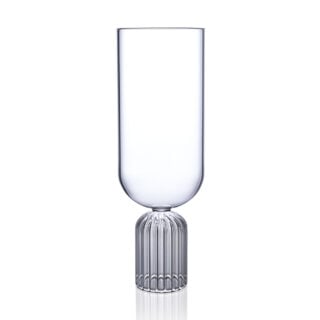 FERRONE-MediumTall-MATM02-HR-01-Unstyled-1200×1200-100KB Minimalist studio display of a Fferrone May Tall Medium Glass in fluted borosilicate glass featuring a tall U-shaped bowl and a ribbed cylindrical pedestal base | Kneen & Co