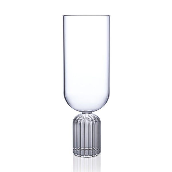 Minimalist studio display of a Fferrone May Tall Medium Glass in fluted borosilicate glass featuring a tall U-shaped bowl and a ribbed cylindrical pedestal base | Kneen & Co