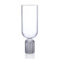 Minimalist studio display of a Fferrone May Tall Medium Glass in fluted borosilicate glass featuring a tall U-shaped bowl and a ribbed cylindrical pedestal base | Kneen & Co