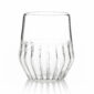 Minimalist studio display of a FFferrone Mixed Small Glass in fluted borosilicate glass featuring a tapered silhouette and a short ribbed base | Kneen & Co