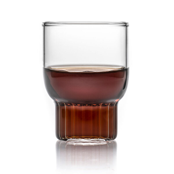 FERRONE-Rasori-Mini-STYLED-1200x1200-100KB Minimalist studio display of a Fferrone Rasori Mini Glass in fluted borosilicate glass filled with a dark spirit | Kneen & Co