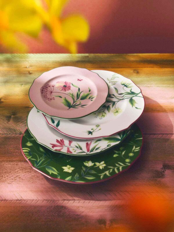 Rustic wooden table set with Ginori 1735 Florenza dinnerware in fine porcelain featuring botanical floral motifs and scalloped edges | Kneen & Co