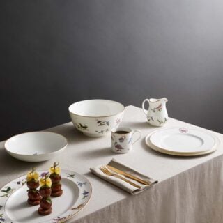 Wedgwood-Mythical-Creatures-Dinner-Square-1200w-100KB Wedgwood Kit Kemp Mythical Creatures Dinnerware set on dining table | Kneen & Co