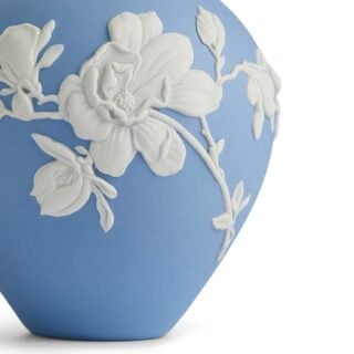 Close-up shot of a Wedgwood Magnolia Blossom Bud Vase in Jasperware matte stoneware with intricate white magnolia relief petals | Kneen & Co