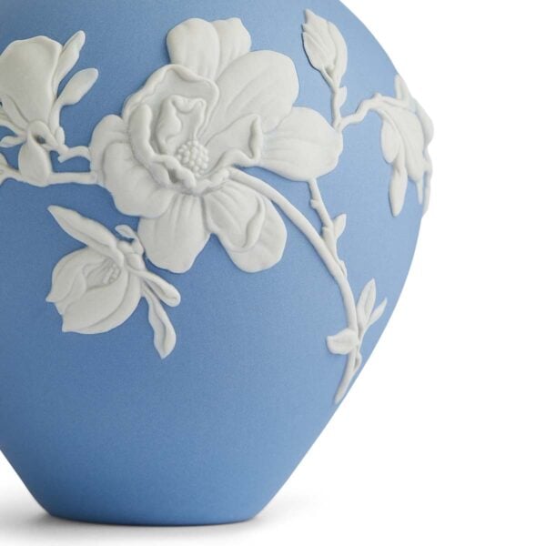 701587315234-Wedgwood-Magnolia-Blossom-Bud-Vase-14cm-detail2-1200x1200-100KB Close-up shot of a Wedgwood Magnolia Blossom Bud Vase in Jasperware matte stoneware with intricate white magnolia relief petals | Kneen & Co