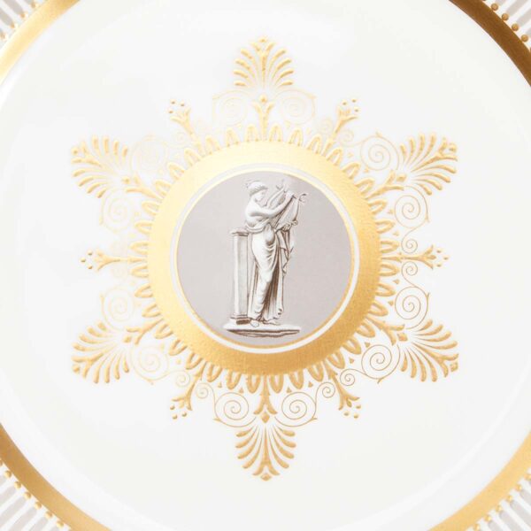 Close-up shot of Wedgwood Anthemion Grey Salad Plate defined by a sophisticated grey rim and an intricate neoclassical palmette border finished with 22-carat gold detailing | Kneen & Co