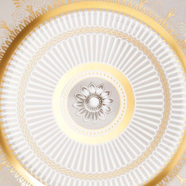701587432979-Wedgwood-Anthemion-Grey-Plate-20pt6cm-8pt1in-detail-1200x1200-100KB Close-up shot of Wedgwood Anthemion Grey Side Plate defined by a sophisticated grey rim and an intricate neoclassical palmette border finished with 22-carat gold detailing | Kneen & Co