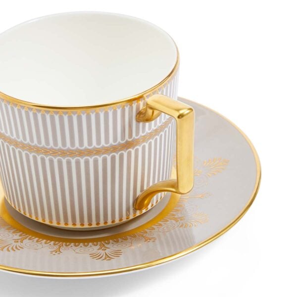 701587433006-Wedgwood-Anthemion-Grey-Teacup+Saucer-detail-1200x1200-100KB Close-up shot of Wedgwood Anthemion Grey Tea Cup and Saucer defined by a sophisticated grey rim and an intricate neoclassical palmette border finished with 22-carat gold detailing | Kneen & Co
