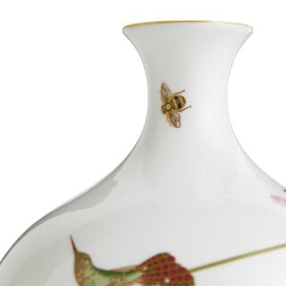 Close-up shot of Wedgwood Hummingbird Medium Vase defined by expressive floral motifs and an artfully sculpted bird finial finished with 22-carat gold detailing | Kneen & Co