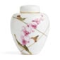 Close-up shot of Wedgwood Hummingbird Small Lidded Vase defined by expressive floral motifs and an artfully sculpted bird finial finished with 22-carat gold detailing | Kneen & Co