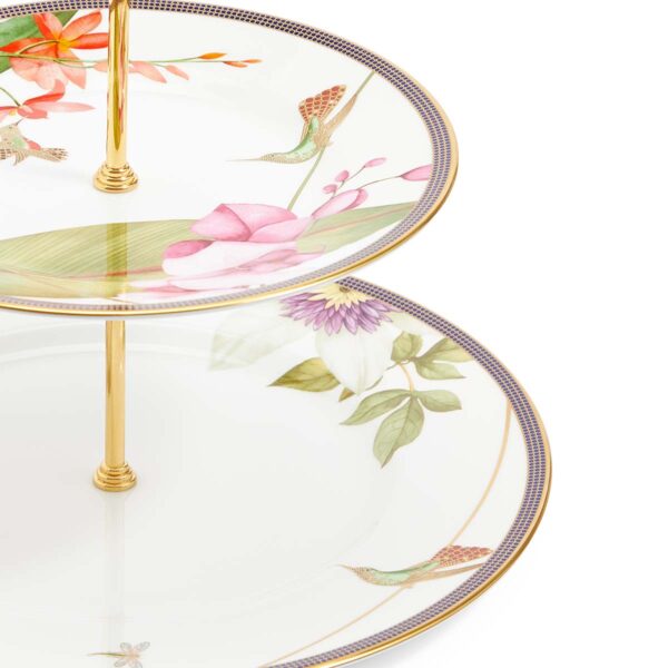 701587439756-Wedgwood-Hummingbird-2-Tier-Cake-Stand-detail-1200x1200-100KB Close-up shot of Wedgwood Hummingbird 2-Tier Cake Stand defined by expressive floral motifs and an artfully sculpted bird finial finished with 22-carat gold detailing | Kneen & Co